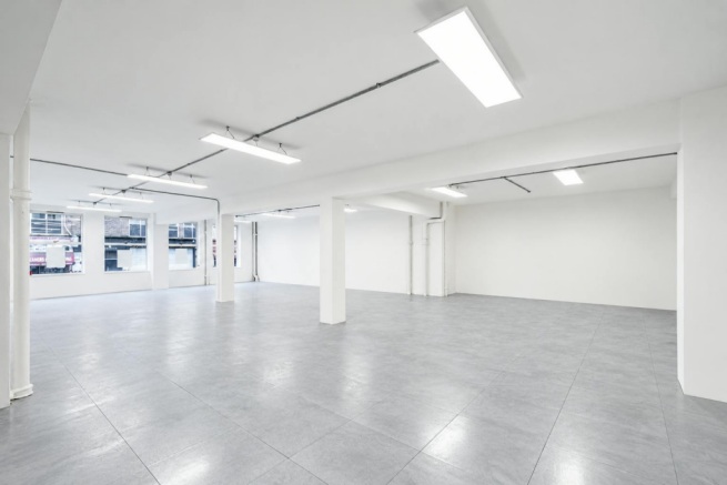 Bright Empty Industrial Loft Interior.png