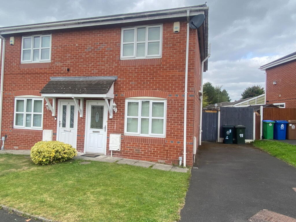 Main image of property: 11 Traynor Close, Middleton M24 5DU