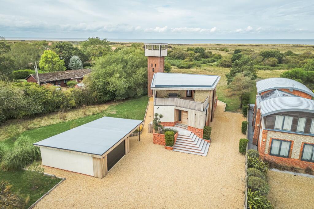 Main image of property: A Four-Bedroom Coastal Home with a Reimagined Period Tower and Panoramic Views