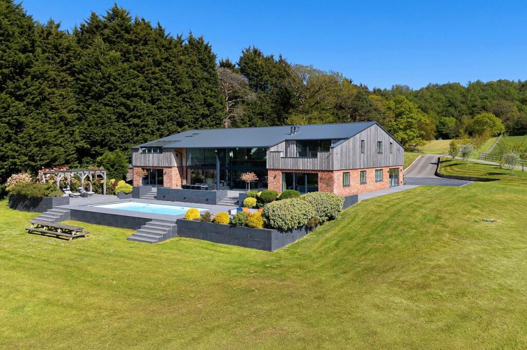 Main image of property: An incredible 8200 sqft house set in 19.5 acres on the edge of Delamere Forest
