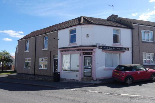 Front..Access to Shop and Apartment