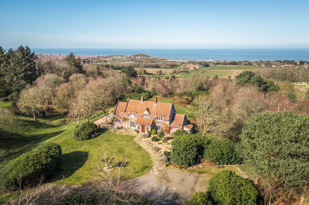 Main image of property: Privacy, Design and Far Reaching Coastal Views in West Runton
