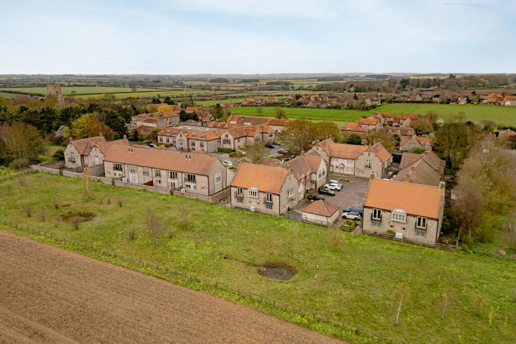 Main image of property: Striking Langham Flint Home in Exclusive Meadow Side Position
