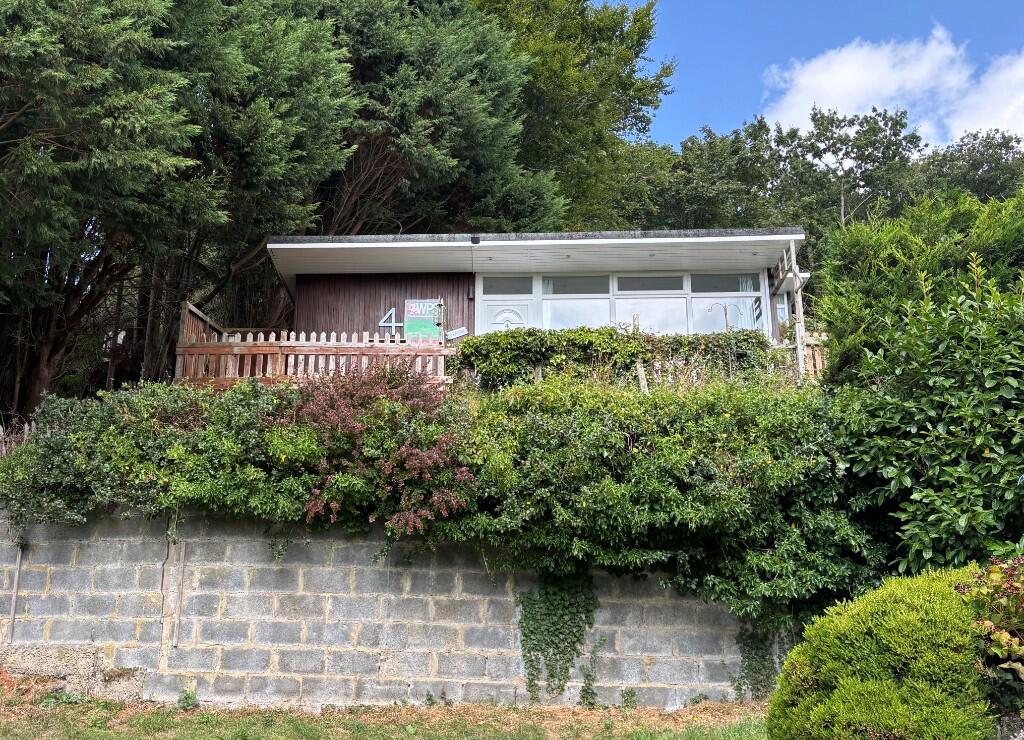 Main image of property: Chalet 4 Woodlands Holiday Park, Bryncrug LL36 9UH