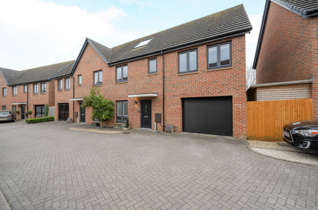 Main image of property: Bullock Crescent, Woking, Surrey, GU22