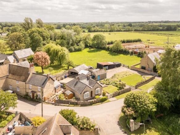 Bungalow to left, plot to right