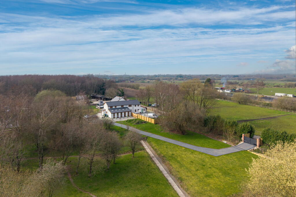 Main image of property: Modern Barn Conversion Set On Over An Acre of Land in Astley Green