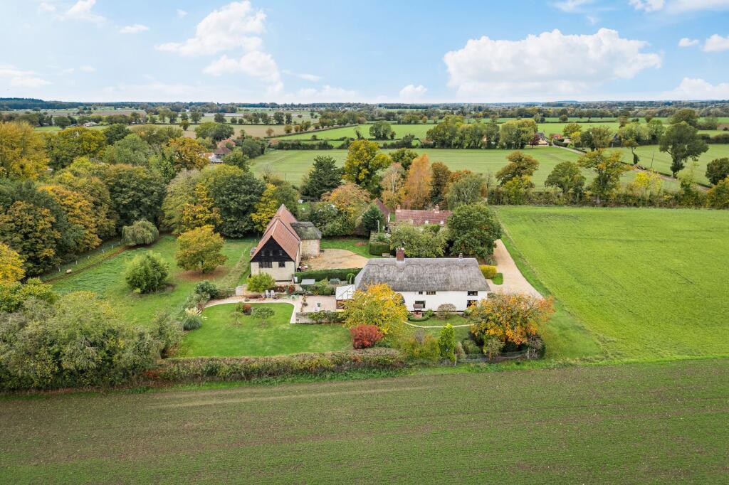 Main image of property: Handsome Thatched Farmhouse in Merton