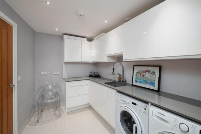 Separate Laundry with Adjacent Guest Cloakroom