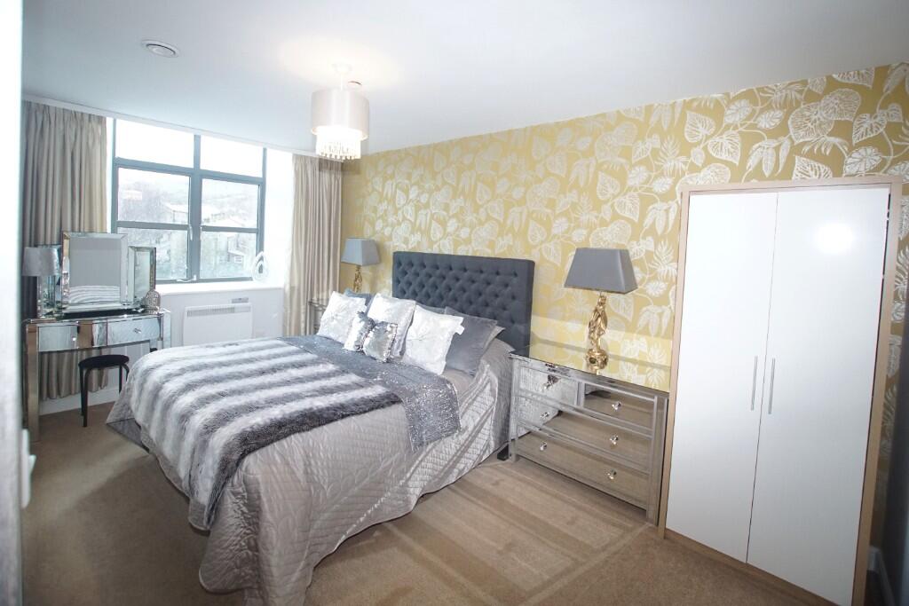 Main image of property: **STUNNING** Wren Nest Mill, Glossop Brook Rd, Glossop, SK13 8GJ