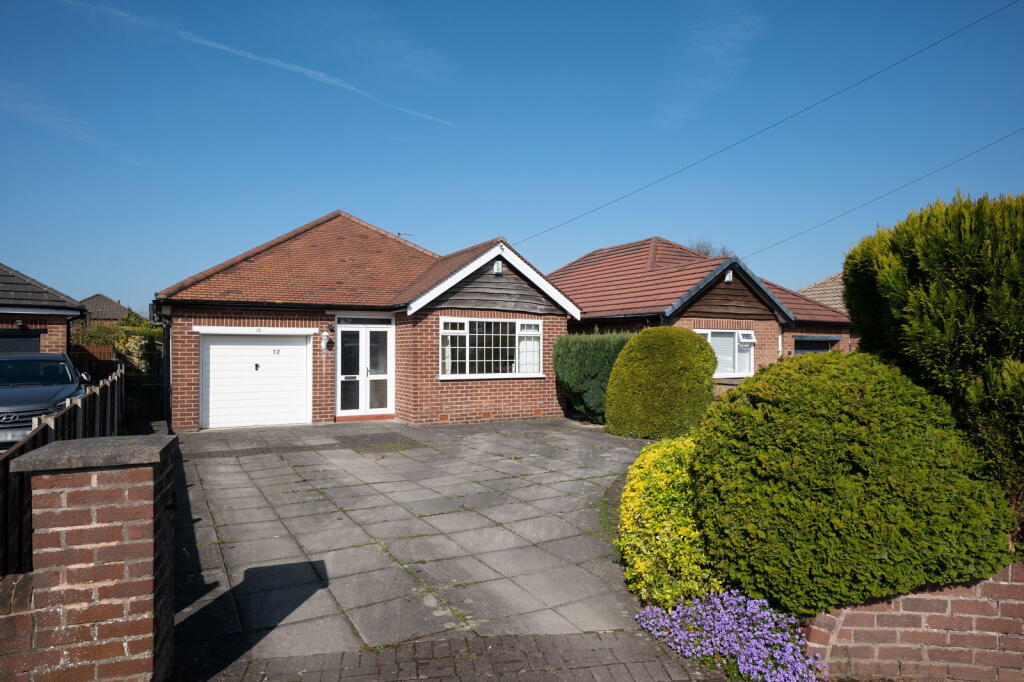 Main image of property: Belvoir Avenue, Hazel Grove, Stockport SK7 6DL