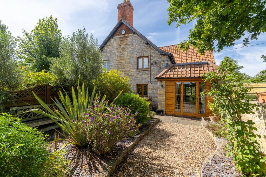 Main image of property: Pretty period cottage in popular village of Butleigh