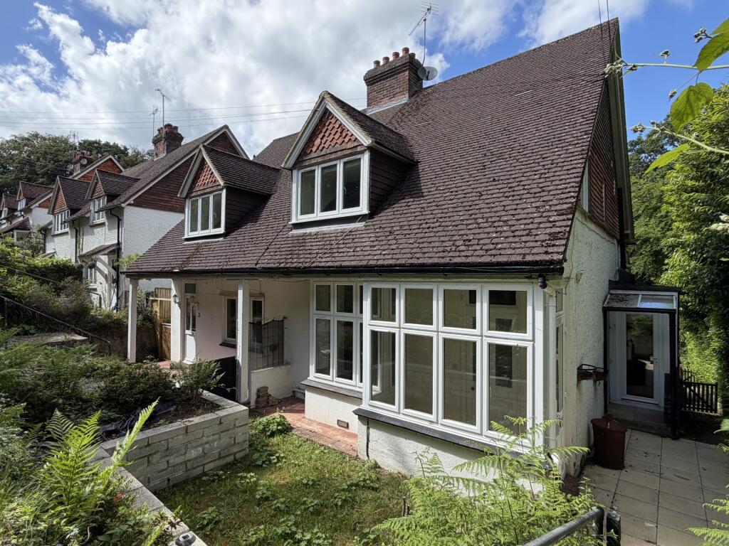 Main image of property: Adjacent woodland
