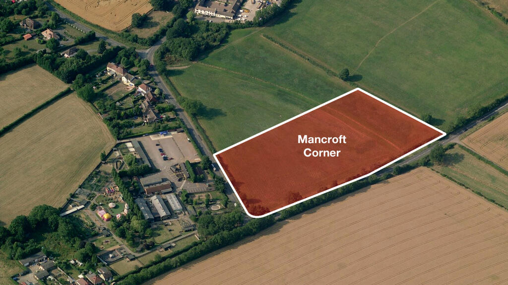 Land opposite commercial property.
