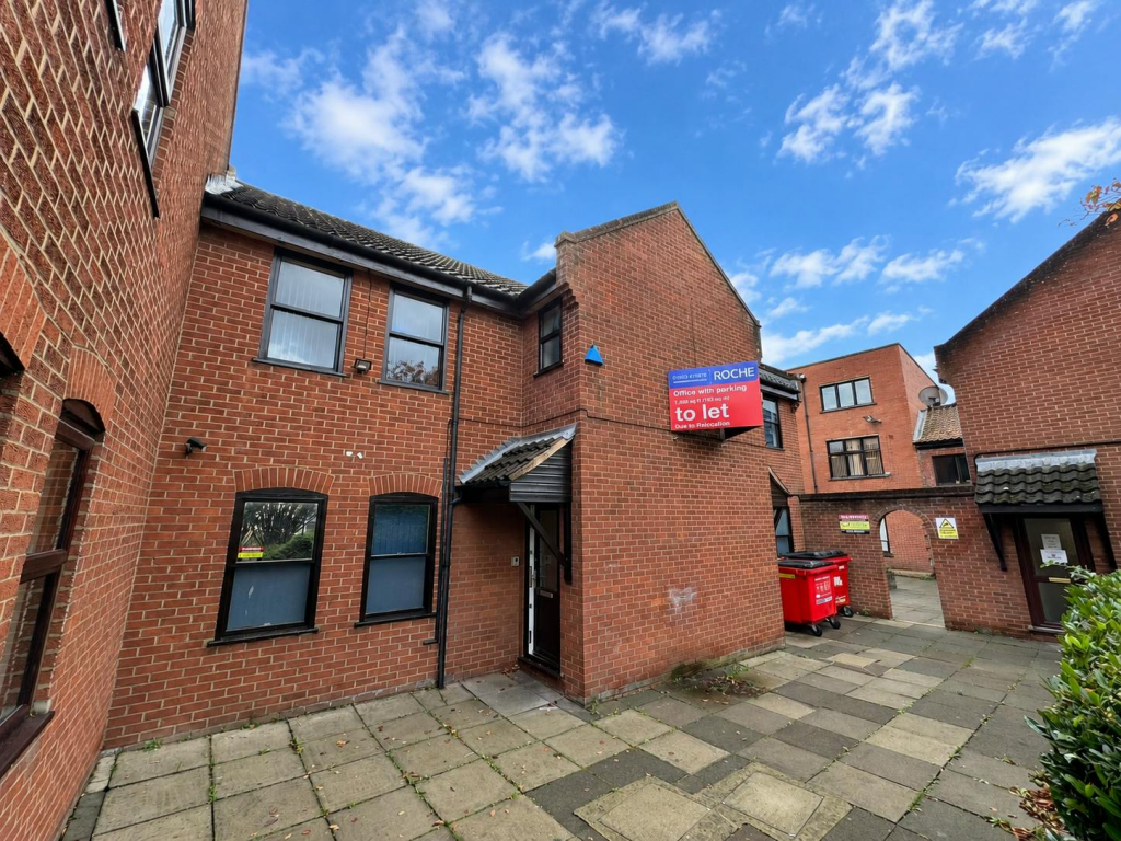 Sunny Brick Courtyard with Letting Sign.png