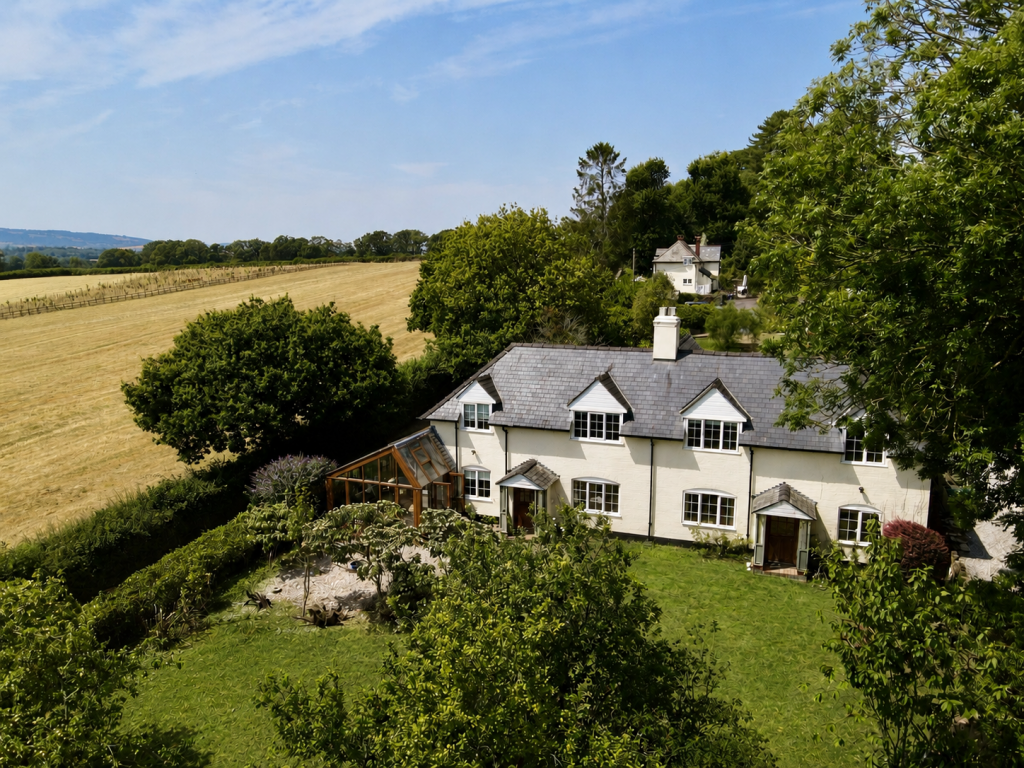 Main image of property: Triscombe - A Characterful Country Home with 0.65 Acres, Endless Potential & Stunning Views