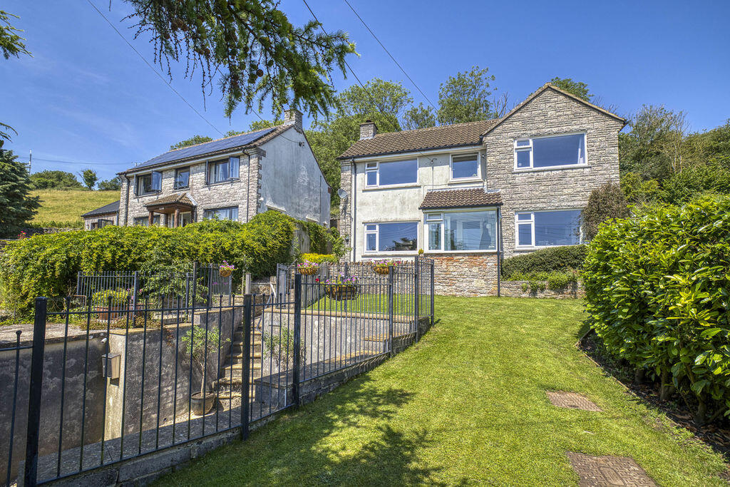 Main image of property: Elevated detached village home in West Horrington enjoying open views across Wells