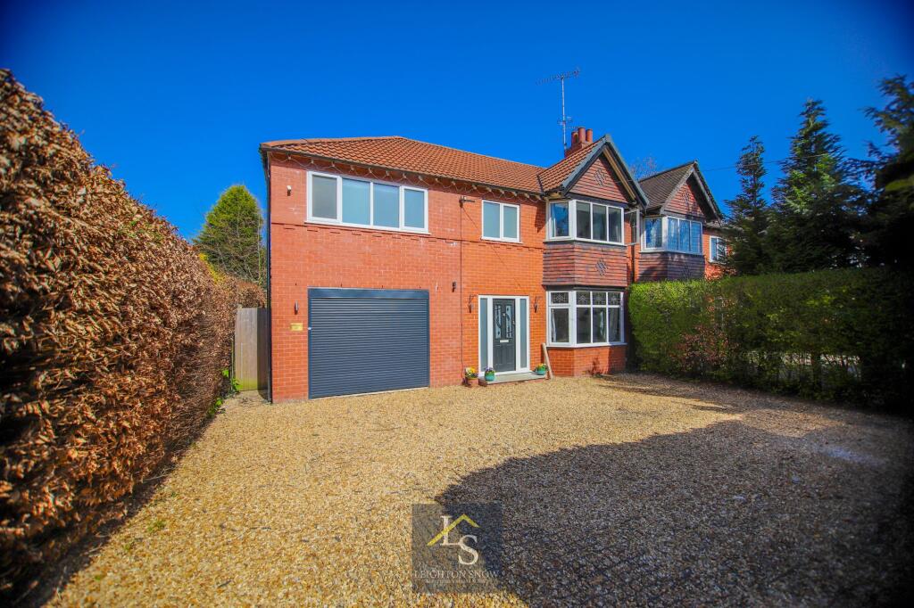Main image of property: Bridge Lane, Bramhall, SK7