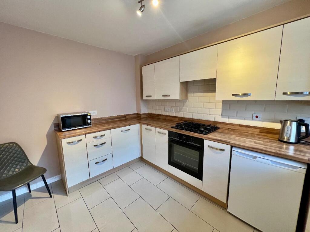 House in Coity - More