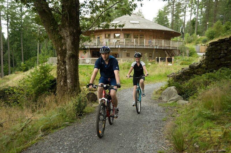 1961_Couple riding out from the visitor centre on the family trail at Coed y Brenin_Natural Resources Wales_No Restrictions_n_a.jpg