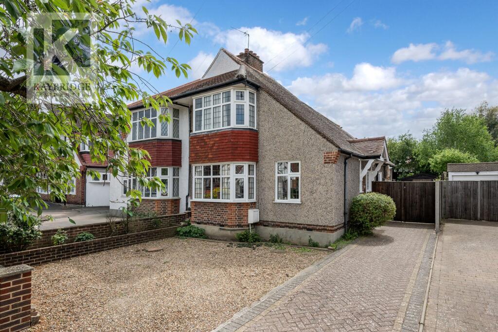 Main image of property: Briarwood Road, Stoneleigh, KT17