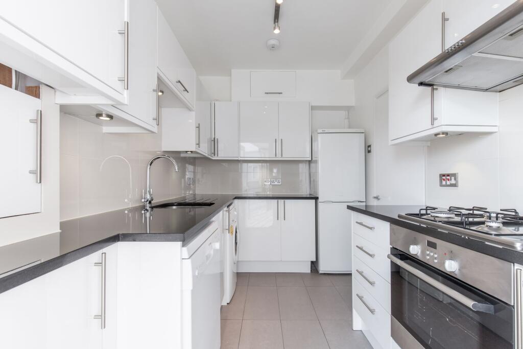 Main image of property: 17 Brondesbury Court 235 Willesden Lane