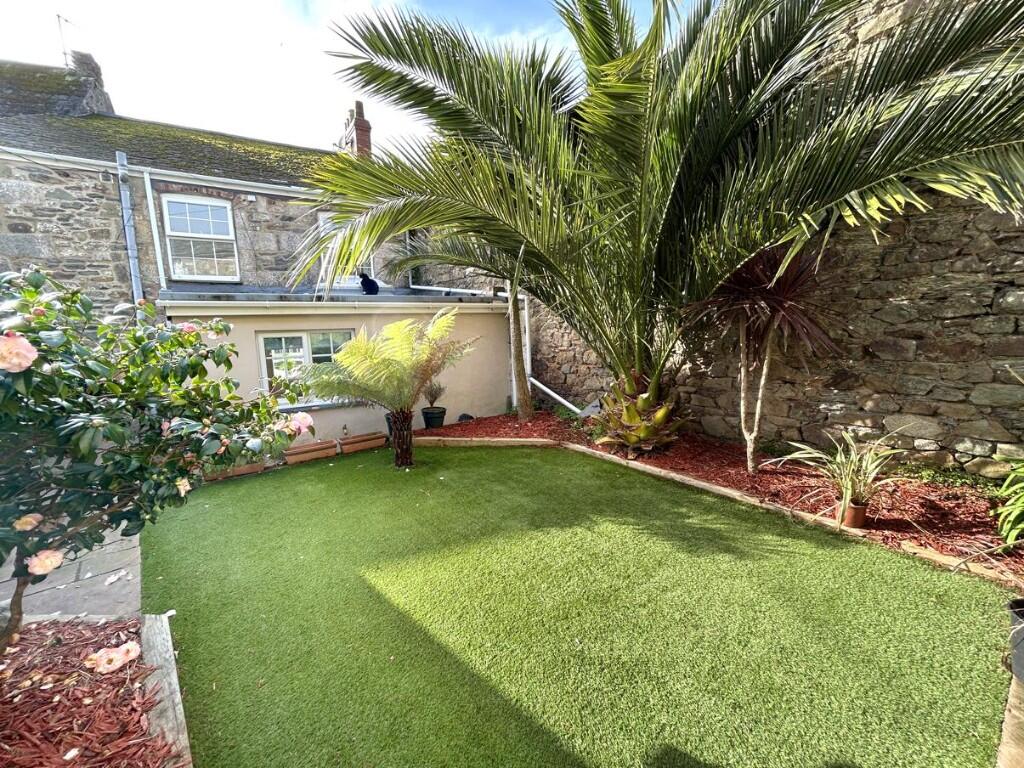 Main image of property: Town centre living with a hidden gem garden
