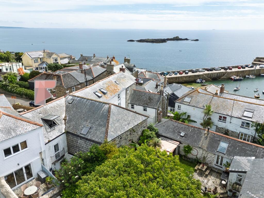 Main image of property: Commerical Road - Mousehole - Stunning 3 bedroom terraced home in Mousehole