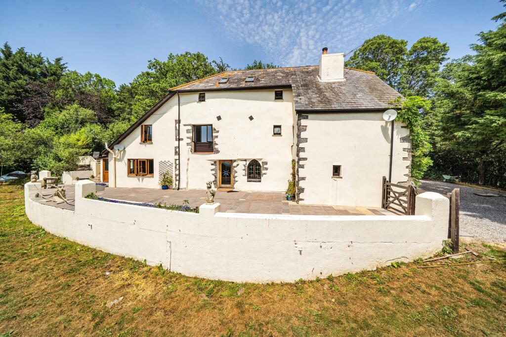 Main image of property: Woodland, Ashburton