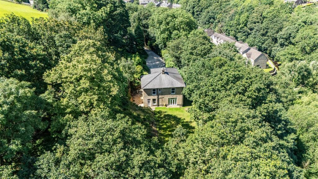 Main image of property: The Woodlands, Ripley Terrace, Luddendenfoot, Halifax, HX2 6AN