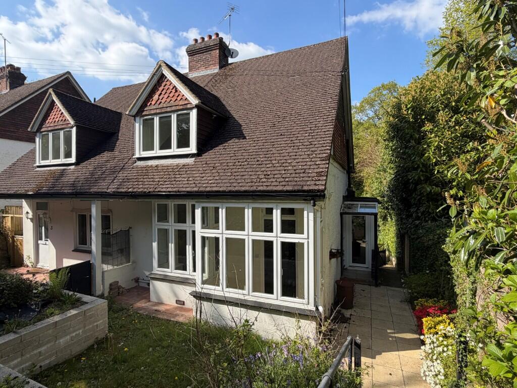 Main image of property: Adjacent woodland