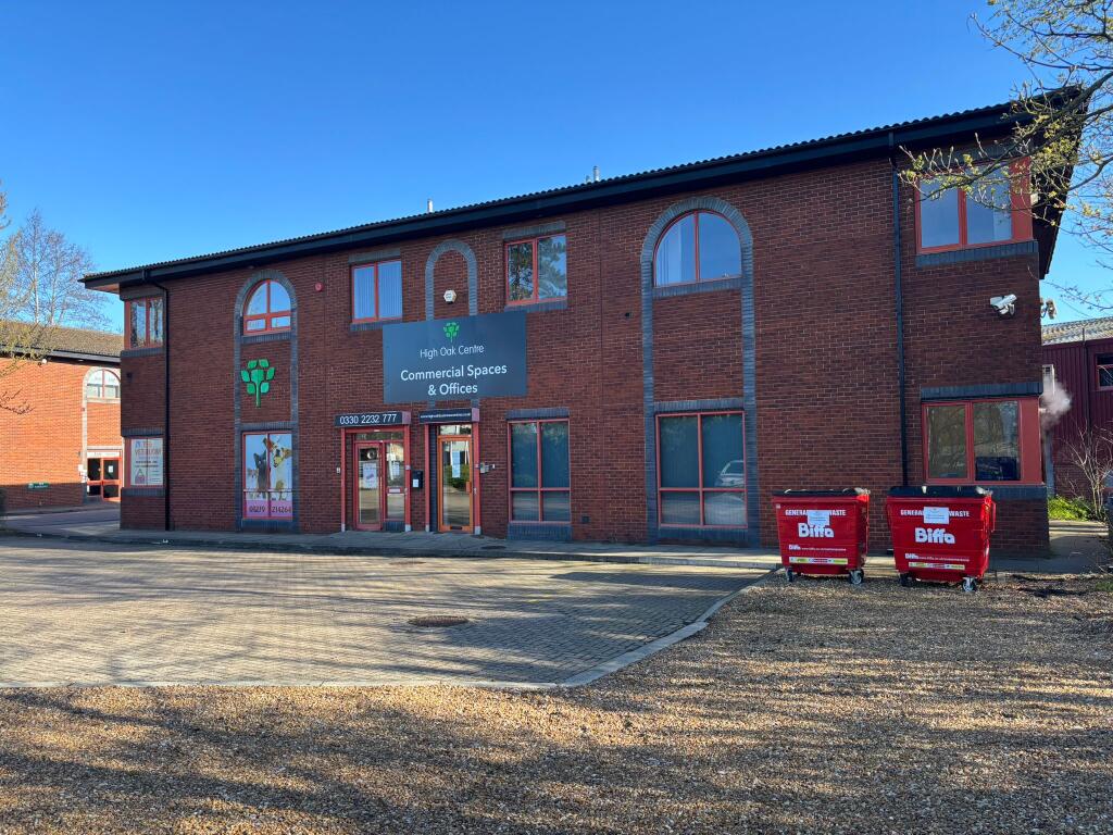 Front of building with large car park