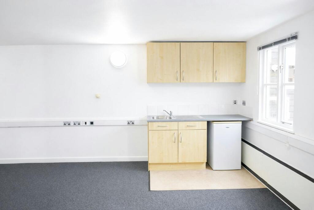 Bright and compact office kitchenette.jpeg