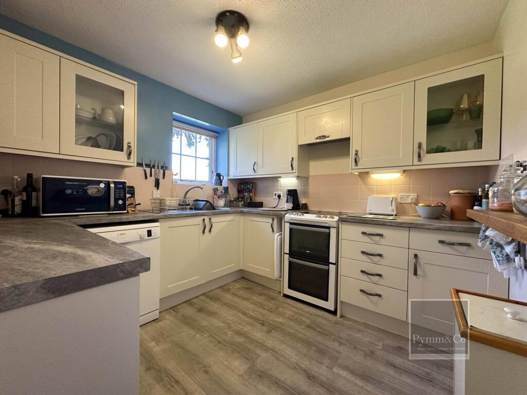 Deceptively Spacious 2/3 Bed House On Desirable Retirement Development in the Heart of Holt Town Centre. photo 3