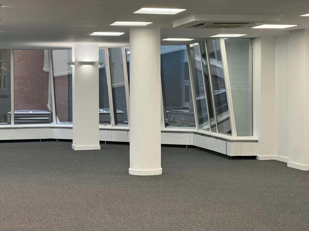 30-31 Furnival 1st Floor OpenPlan Office With Large Windows And Pillar.jpg