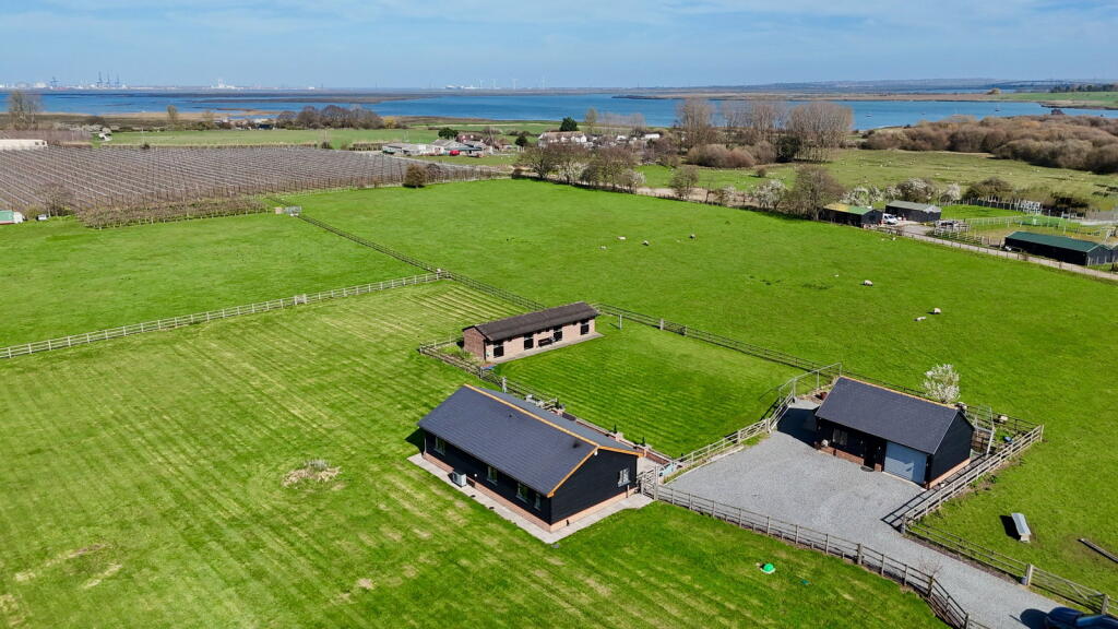 Main image of property: A beautiful barn conversion set in approximately 6.5 acres with stunning countryside surroundings