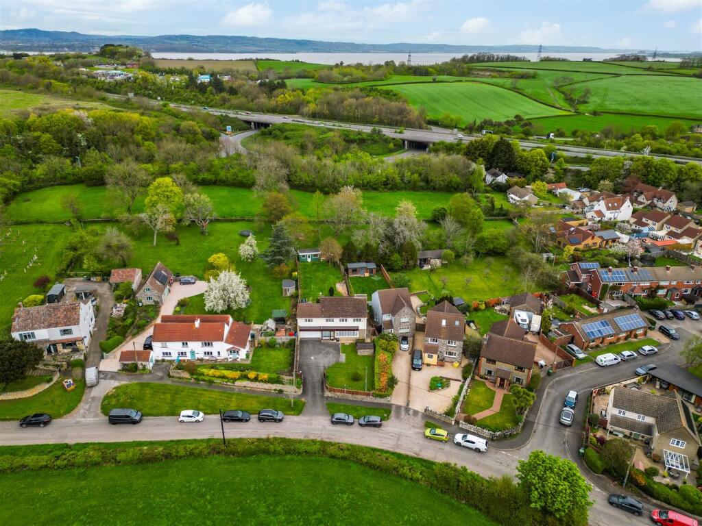Main image of property: Detached 5 bed (2,775 sq ft) family home with large gardens & views in village of Aust