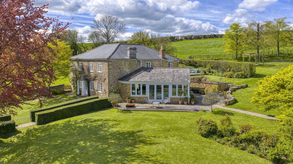 Main image of property: Stunning country house with beautiful views and natural swimming pool in Bratton Seymour