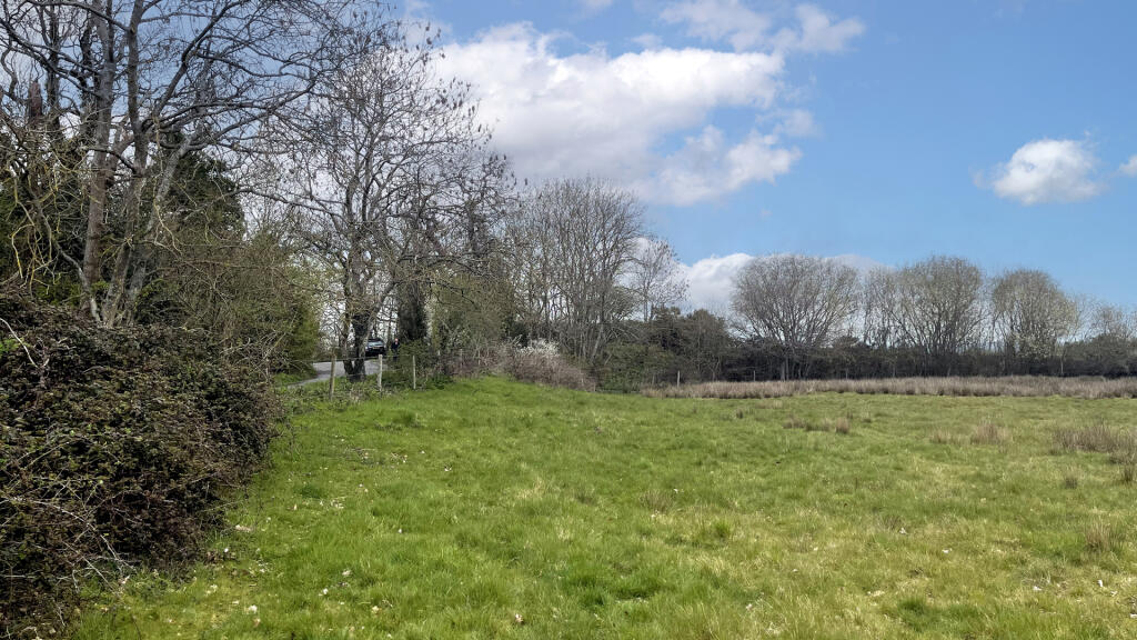 The land benefits from road frontage on two sides.