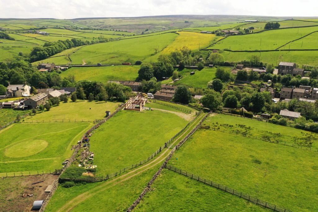 Main image of property: Detached House with Land & Building For Sale – Starkie Heaton Farm, Ickornshaw, Cowling, BD22 0DE