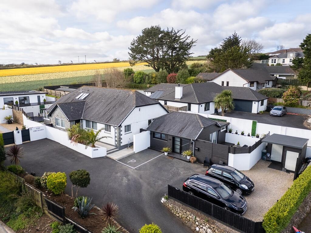 Main image of property: Heather Lane - Stunning 4 Bedroom Home with Detached Annexe