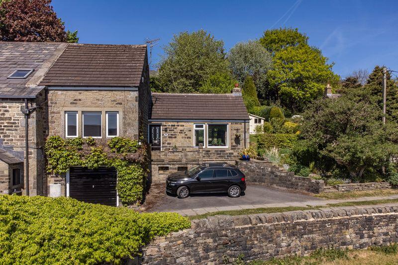 Main image of property: Lady Well Cottage, Castle Lane, Ripponden HX6 4JZ