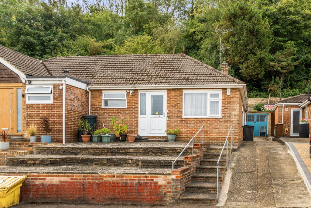 Main image of property: Renovation Opportunity | Spacious 2 Bedroom Bungalow | Garage, Parking & Woodland-Backed Garden