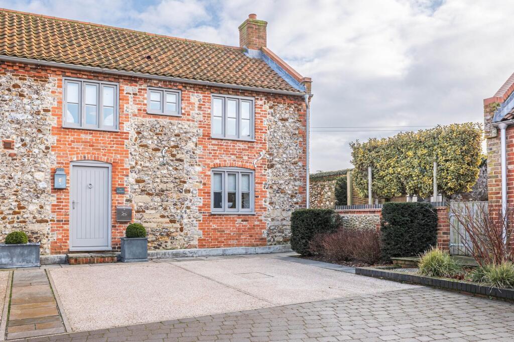 Main image of property: Impeccable Brick and Flint Mews Home in Docking