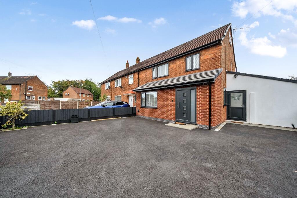 Main image of property: Gated Three Bedroom home in Newall Green M23 with additional Garden Room.