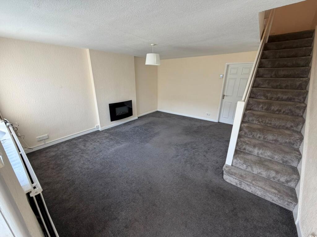 Main image of property: AXMINSTER WALK, BRAMHALL, SK7 2QJ
