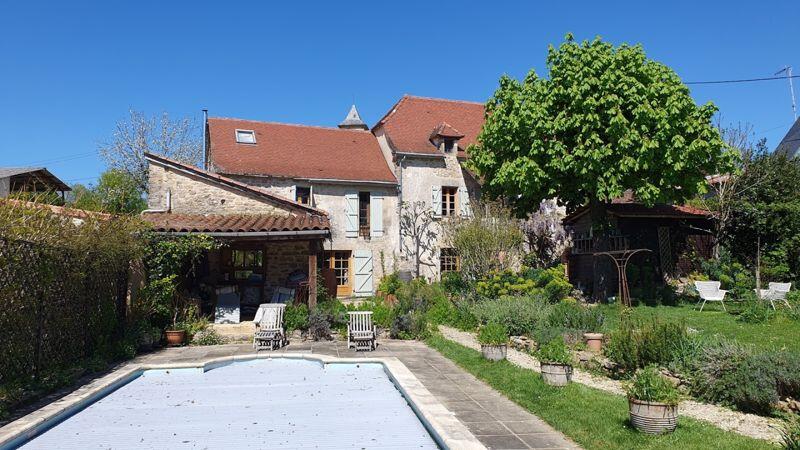 Main image of property: Charming stone housewith swimming pool located in quiet countryside