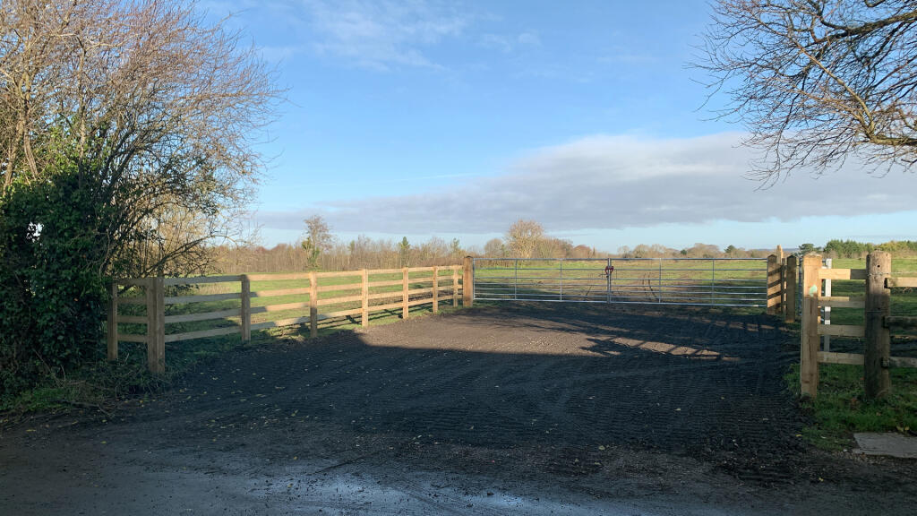 Direct access via a double-gated entrance set-back from the road.