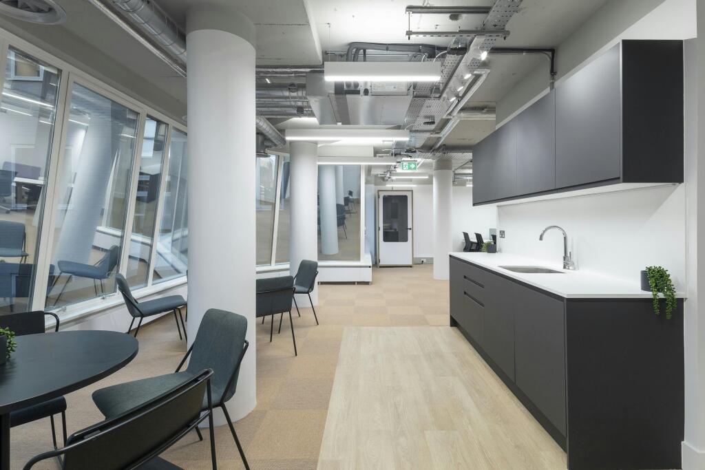 3031 Furnival Street Modern Office Kitchenette With Seating And Large Windows.jpg