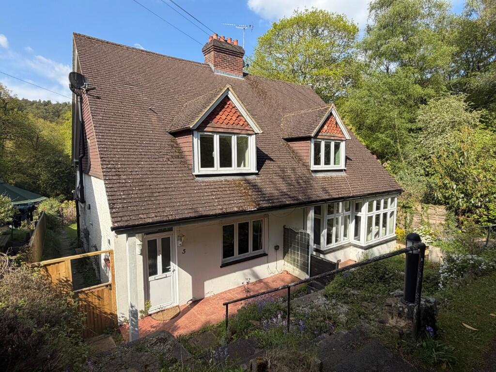 Main image of property: Adjacent woodland